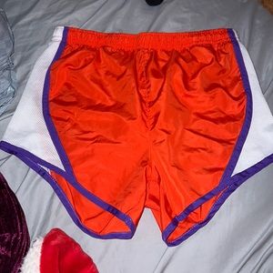 Orange, white, and purple athletic shorts, size medium